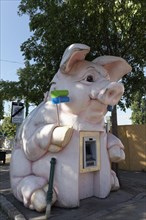 Figure of a pig as ATM