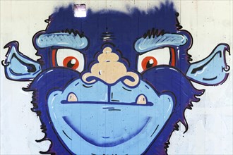Blue monster with a funny monkey face