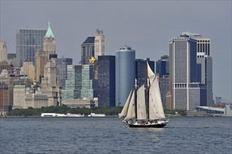 Sail ship on Hudson River in front of South Manhattan sky scrapers