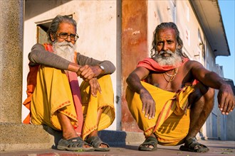 Two Sadhus sitting on the ground
