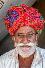 Rajasthani wearing traditional dress and turban at the Pushkar Mela camel fair