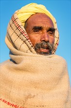 Indian man wearing a yellow turban