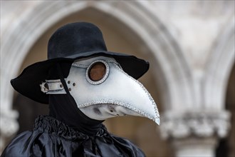A man dressed in plague doctor costume