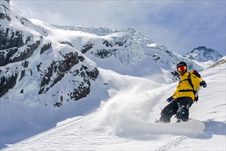 Snowboarder in deep snow