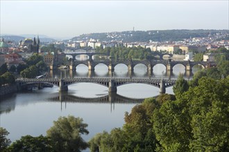 View from Letna Hill over the Vltava River bridges to the historic centre with bridge tower