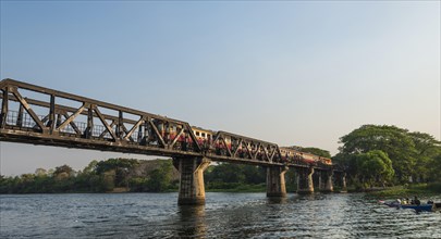 Train crossing historical River Kwai Bridge
