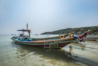 Colourful long-tail boats in sea