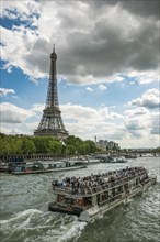 Eiffel Tower with Seine and excursion boat