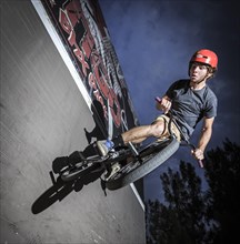 Teenager with BMX bike at skate park