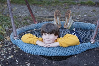 Boy in a swing nest