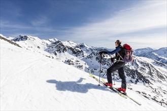 Ski tourer ascending the Madritschspitze in Butzental