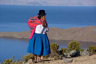 Indio woman in traditional festive costume for the New Year Festival of the Aymara Indians