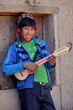 Student playing ukulele at boarding school