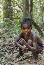 Little boy of the Orang Asil tribe grinning