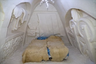 Bedroom with wall relief in the ice hotel