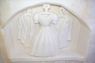 Wall relief of clothes in the ice hotel