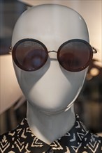 Modern head of a mannequin wearing sunglasses