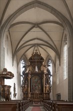 Interior with Baroque high altar and pulpit of the former monastery Kreuzthal-Maria Burghausen