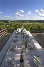 Nicely laid table in front of the Franconian Switzerland countryside