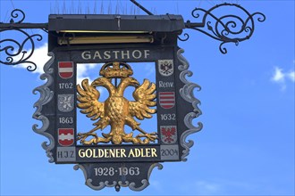 Gasthof Goldener Adler signboard and blue sky