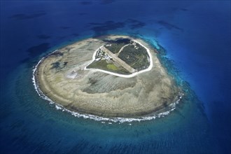 Fringing reef around small island with runway
