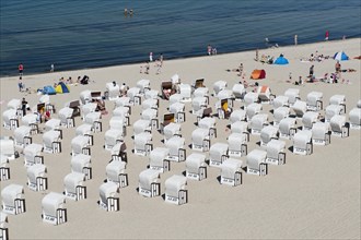 Vacationers and beach chairs on the beach of Sellin