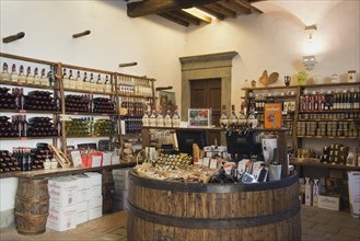 Wine shop with wine bottles and small delicacies