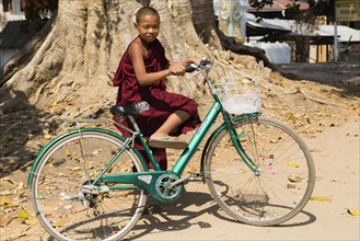 Monk on a bicycle at the Five-Day Market