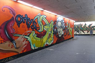 Graffiti with portrait of composer Mozart in underground passageway