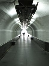 Passers-by in a tunnel