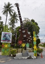Oversized guitar and image of Bob Marley