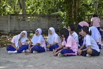 Students sitting on the floor