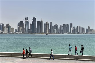 Corniche promenade and skyscraper skyline