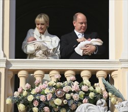 Princess Charlene and Prince Albert II of Monaco presenting their twins Prince Jacques and Princess Gabrielle at the palace window to the public for the first time