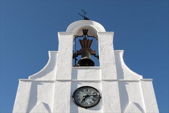 White bell-tower with clock