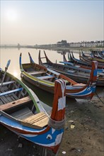 Fishing boats at the shore of Taungthaman Lake near the U Bein Bridge