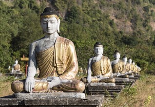 Buddha statues lined up in rows at the foot of Mt Zwegabin