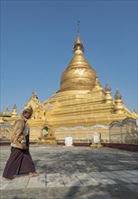 Man circling Kuthodaw Pagoda