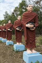 Row of statues of the 500 Arahant followers of Buddha at Win Sein Taw Ya