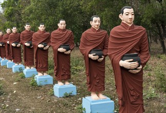 Row of statues of the 500 Arahant followers of Buddha at Win Sein Taw Ya