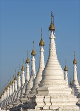 Row of white stupas of Sandamuni or Sanda Muni Pagoda