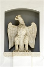 Stone imperial eagle next to the portal of the Heilig-Geist-Spital hospital
