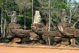 Asura sandstone statues in front of the South Gate of Angkor Thom