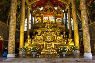 Golden Buddha statues in the temple district Wat Phra That Nong Bua