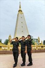 Female soldiers of the Thai Army in front of stupa in Wat Phra That Nong Bua