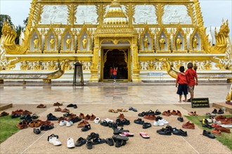 Shoes in front of Wat Phra That Nong Bua