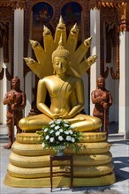 Golden Buddha in front of Wat Sa Suk Prasan temple ship in Wat Ban Na Muang