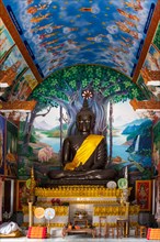 Buddha statue inside the Wat Sa Suk Prasan temple ship