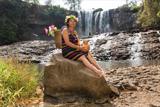 Phnong woman posing for tourists at the Bousra waterfall