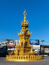Golden ornate clock tower Ho Nalika at the Thanon Banphaprakan